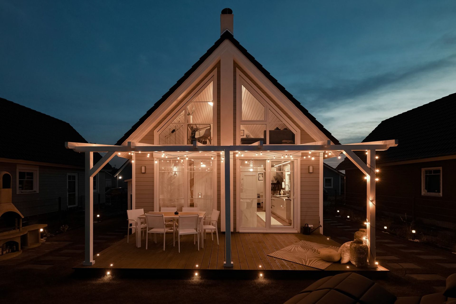 ABAITA Ferienhaus at night with the terrace lights on