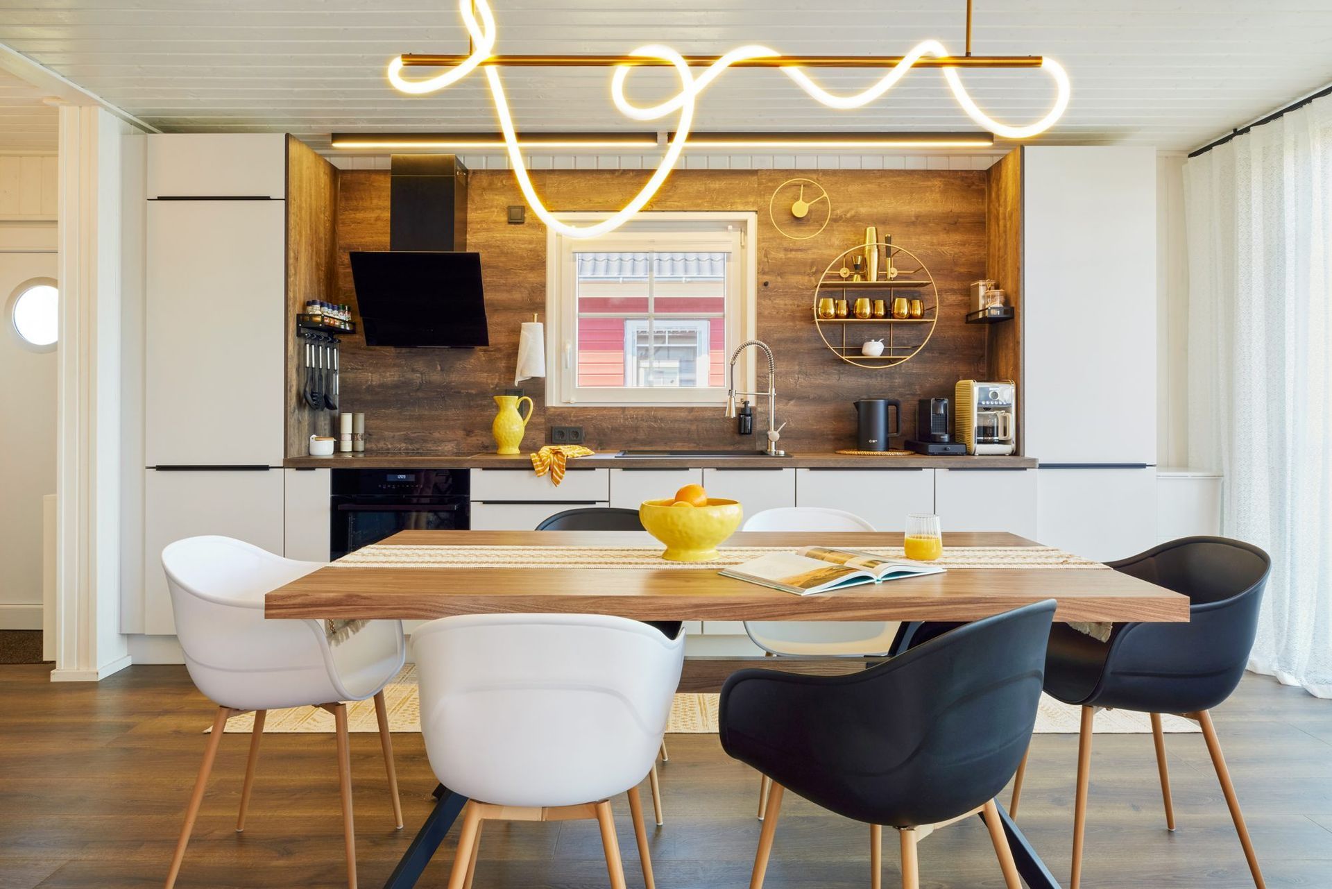 Open kitchen with dining table and pendant light