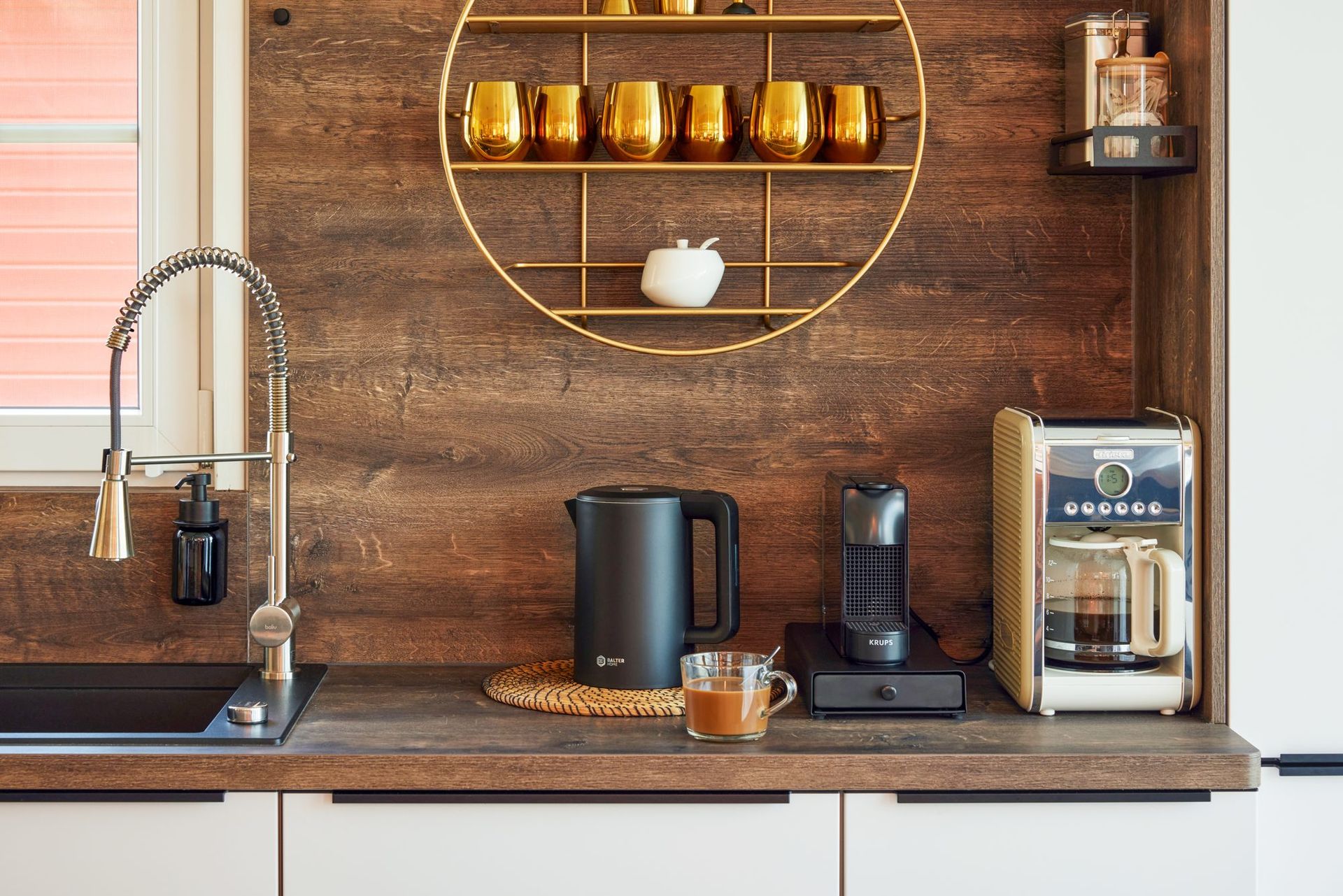 Coffee corner with Nespresso machine and brass cups