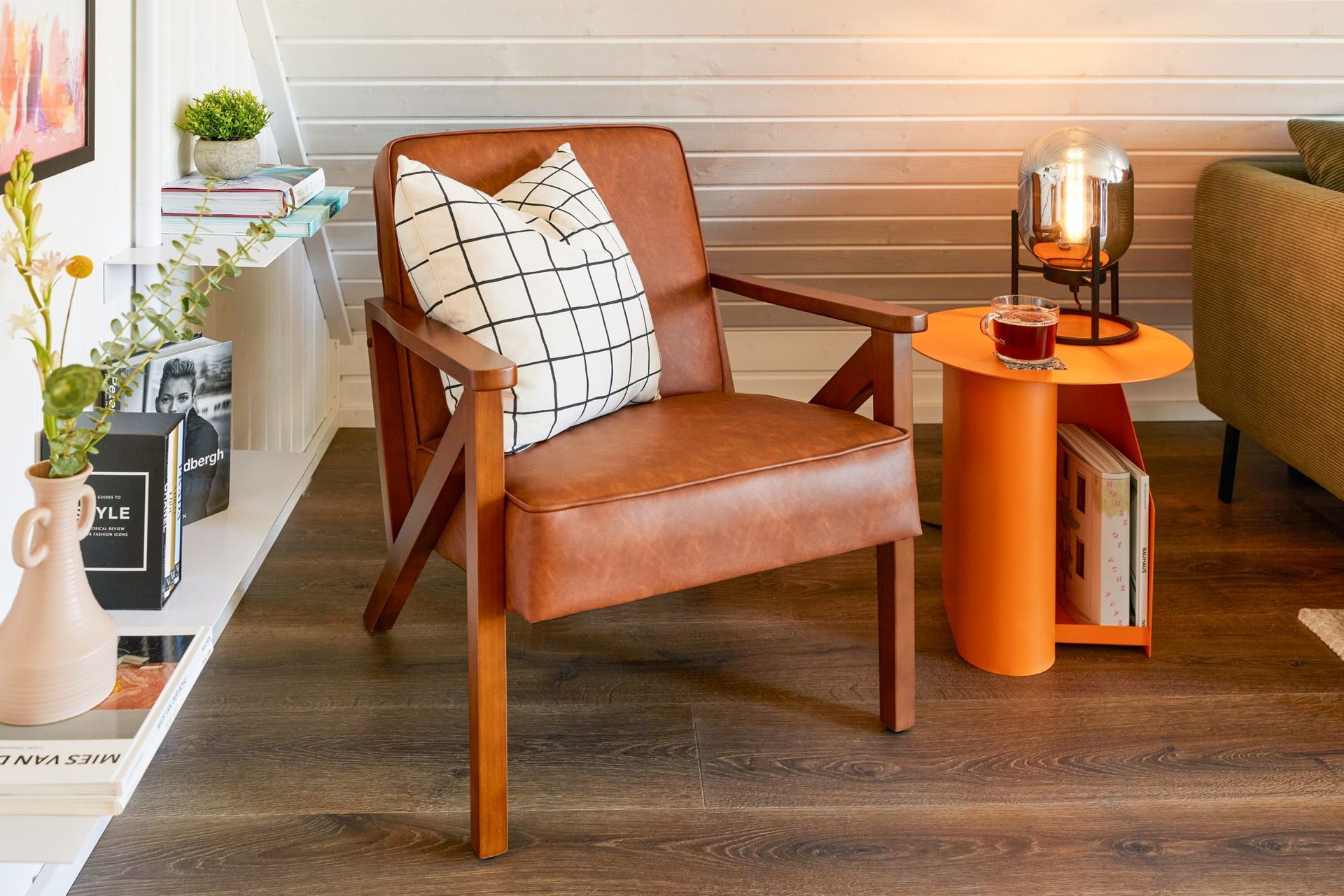 Leather armchair with a lamp and a plant