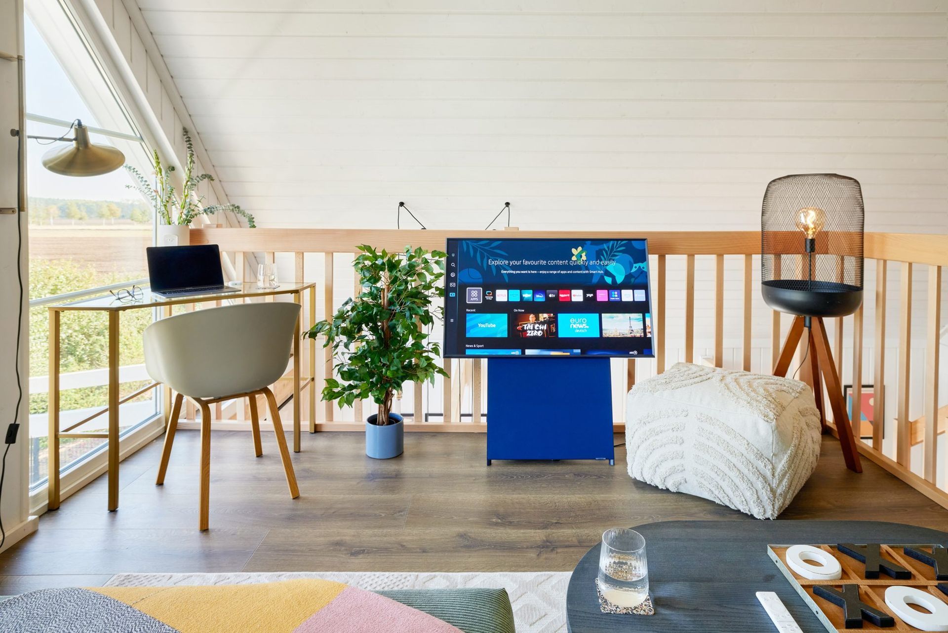 Upstairs gallery with desk and TV