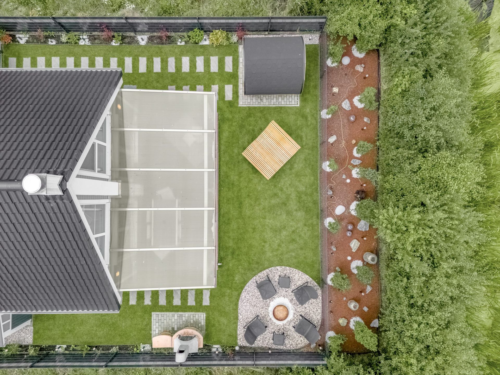 Aerial view of the garden with fire pit and sauna