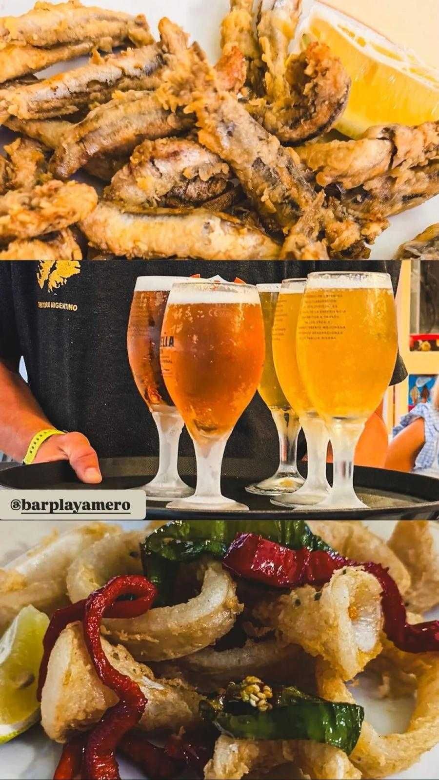 Vasos de cerveza frente a un plato de mariscos fritos y un plato de verduras salteadas con pimientos rojos.