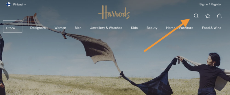 Harrodsin verkkosivuston etusivu, jossa leijan lennättävää banneria ja navigointivalikko aavikkomaisemaa muistuttavalla taustalla