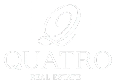 Logotipo de Quatro Real Estate en negro con una Q estilizada sobre el nombre de la empresa.