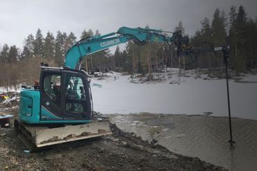 Sininen kaivinkone