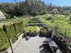 Hanggarten mit Terrasse am Blockhaus Malmkrog