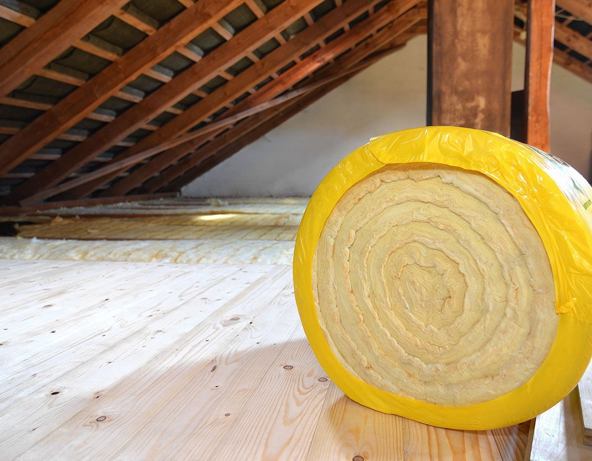 Combles avec rouleau de laine de verre