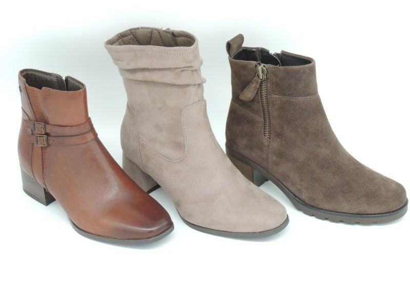 Drei Stiefeletten in Braun, Beige und Taupe nebeneinander auf weißem Hintergrund