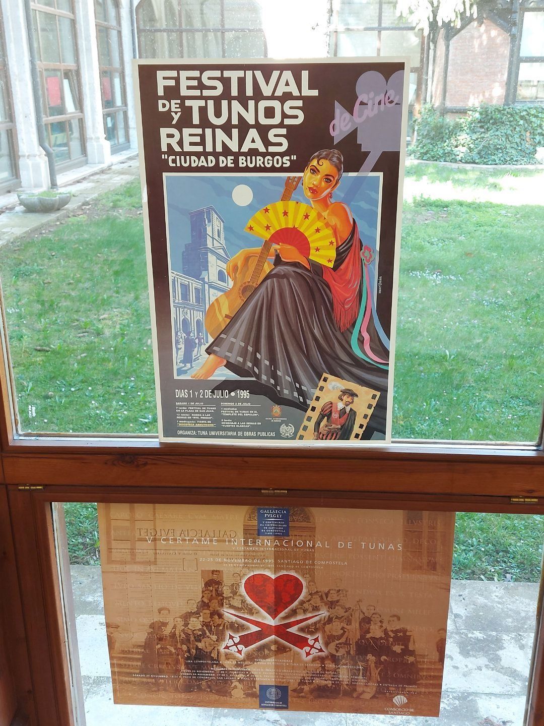 Two posters in a window: 