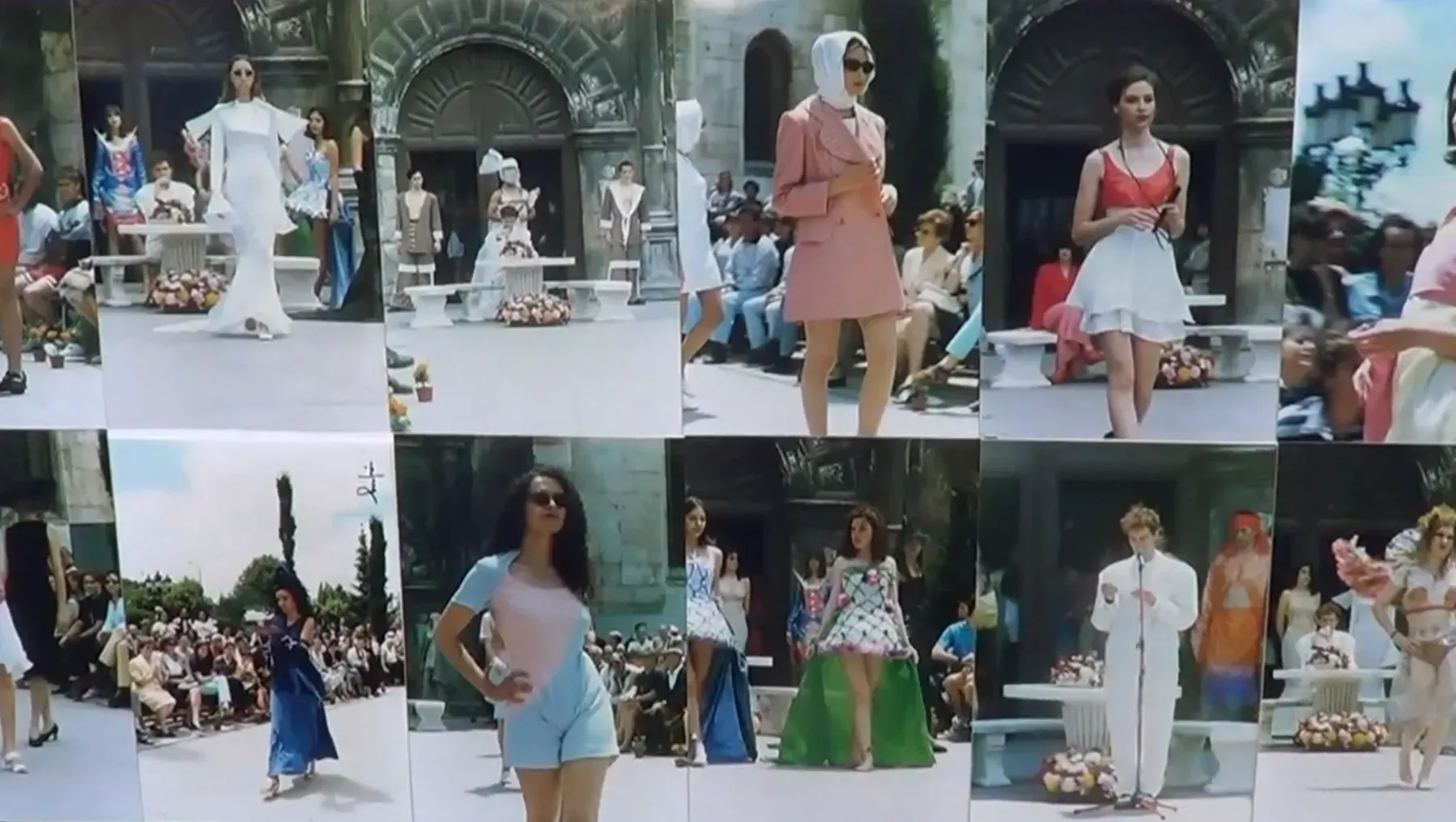 Modelos de moda en una pasarela frente a un edificio, vistiendo una variedad de trajes coloridos.