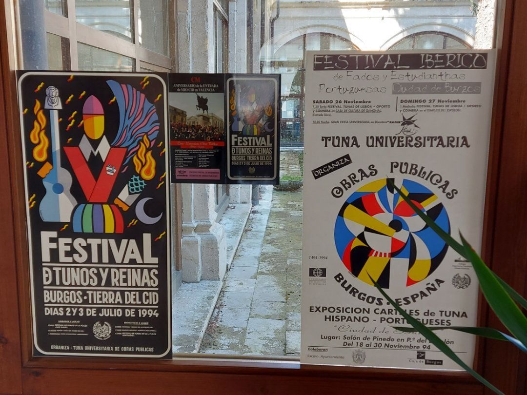 Posters for festivals in window, including one for 