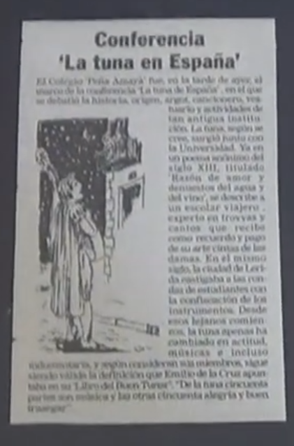 Un recorte de periódico en blanco y negro que anuncia una conferencia 