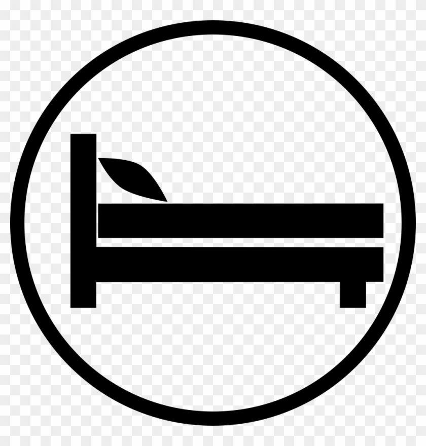 Black silhouette of a bed inside a circle, commonly used to signify a hotel or lodging.