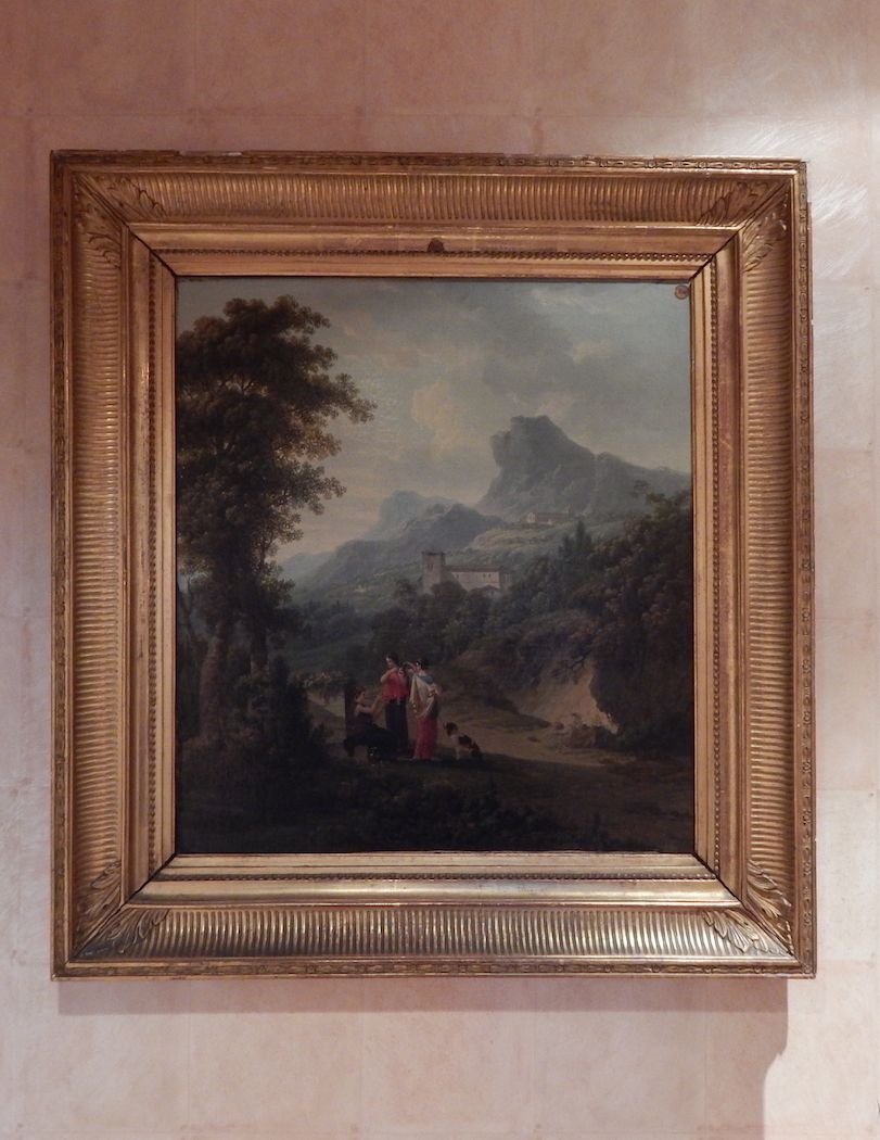 Photo d'un tableau avec un paysage.