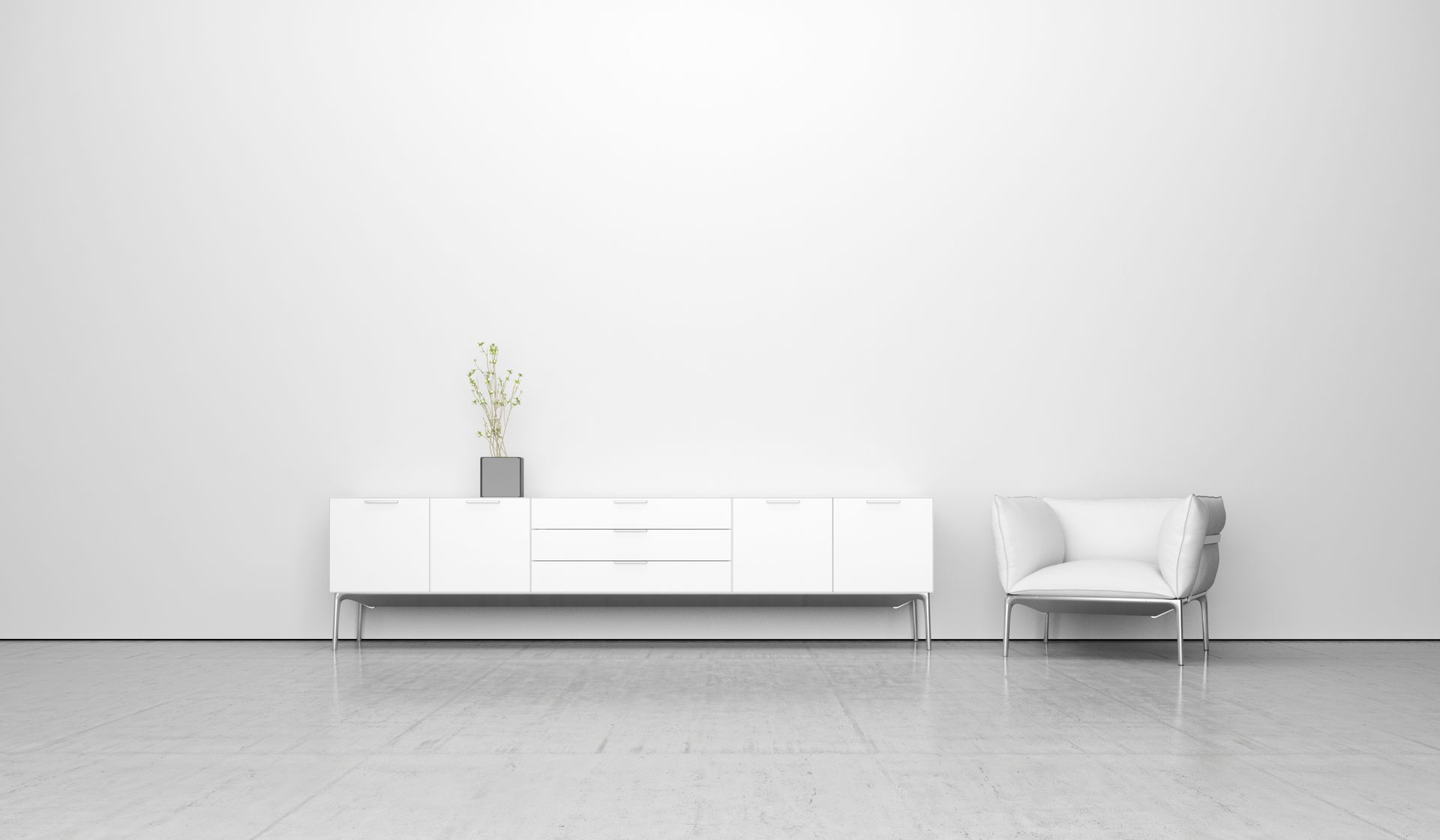 Weisses, minimalistisches Wohnzimmer mit Anrichte, Sessel und Pflanze an einer schlichten Wand.