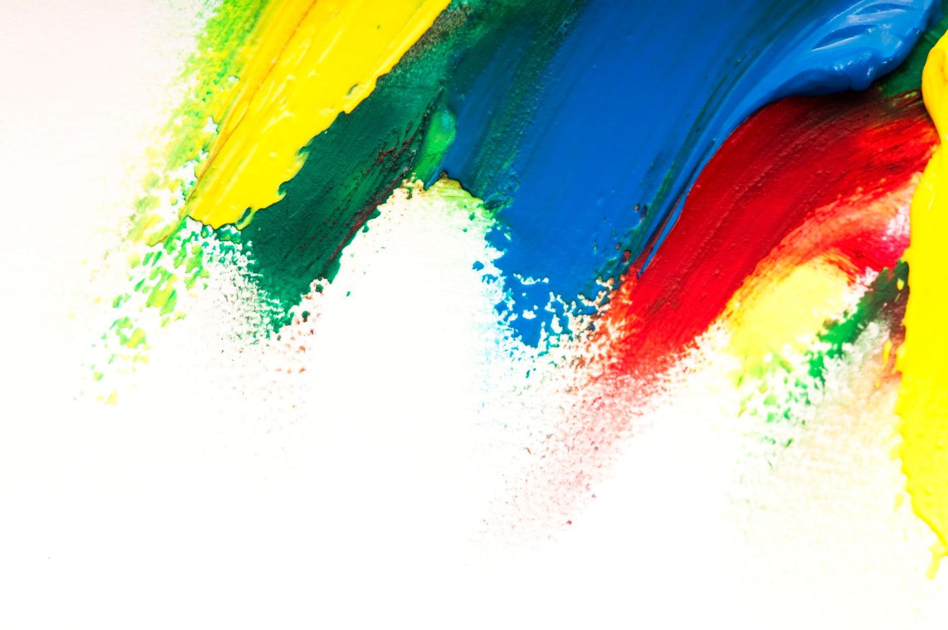 Bunte Farbstriche in Gelb, Grün, Blau und Rot auf weissem Grund.