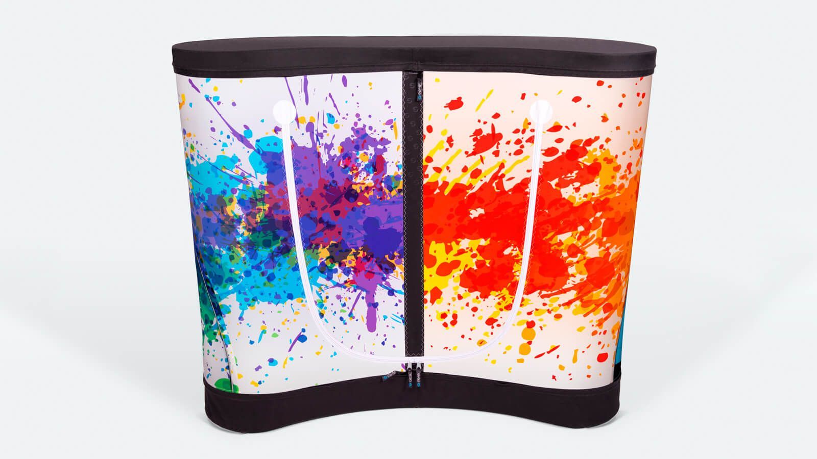 Curved display with colorful blue, purple, orange, and red paint splashes on white background