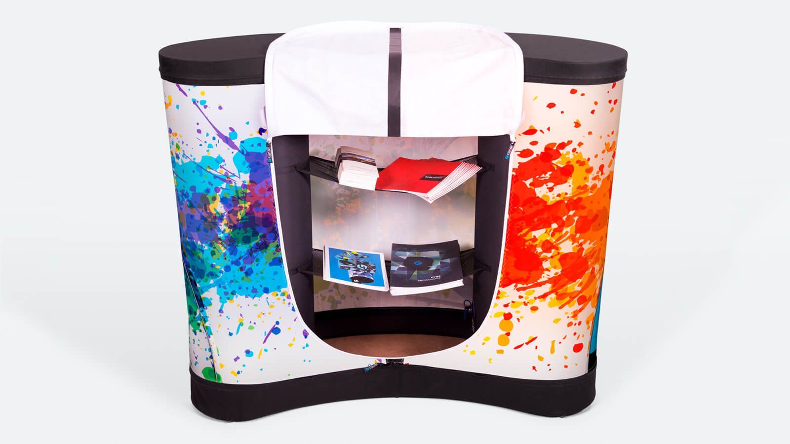 Curved display stand with colorful paint-splatter panels and a central shelf holding small items
