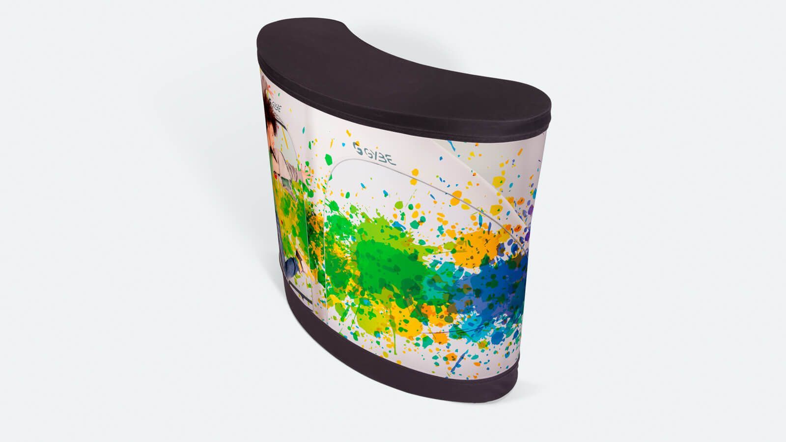 Curved promotional display stand with colorful paint-splatter graphic on white background