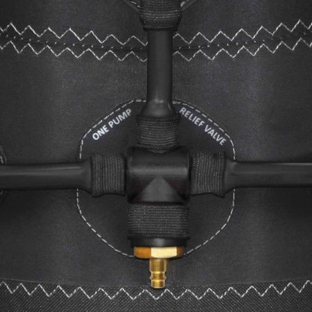 Close-up of a black inflatable valve labeled “one pump relief valve” with a brass nozzle and white stitching