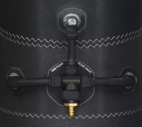 Black mechanical valve with zigzag white stitching on dark fabric, centered in frame