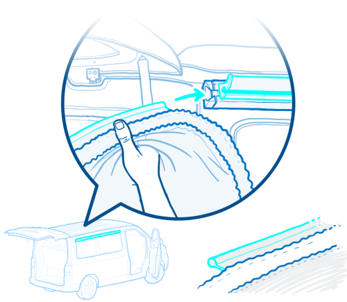 Close-up of a hand inserting a tire bead into a wheel rim, with an arrow showing the sliding motion.