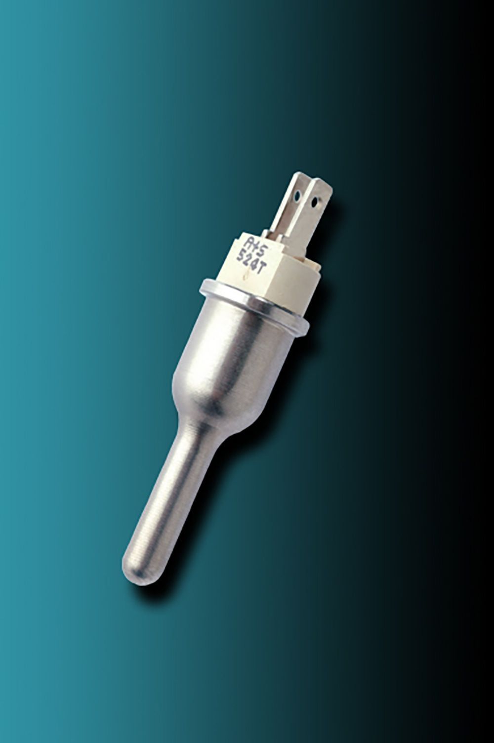 A small metal object is sitting on a blue surface.