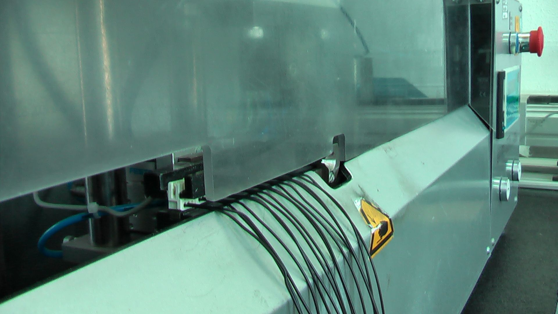 A machine with a bunch of wires coming out of it.