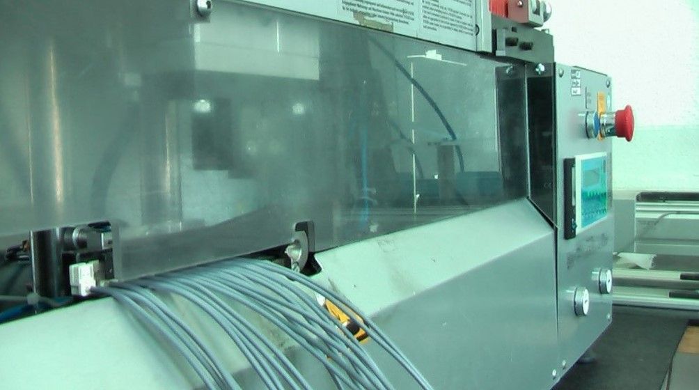 A machine with a bunch of wires coming out of it.