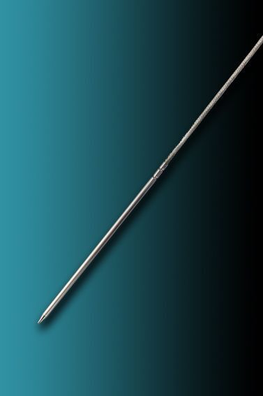 A long metal stick is sitting on a blue surface.