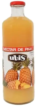 Una botella de jugo de piña con una imagen de piñas en la etiqueta.