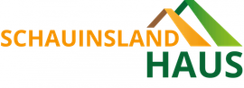 Logo „SCHAUINSLAND HAUS“ mit orangefarbenem Text und grünen Dachformen.