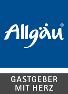 a blue and white logo for allgau gastgeber mit herz