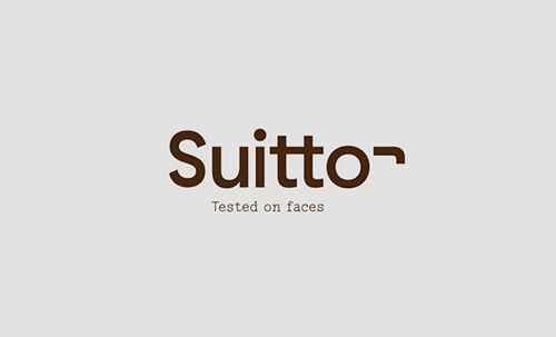 Un logotipo para suitto probado en caras sobre un fondo blanco.