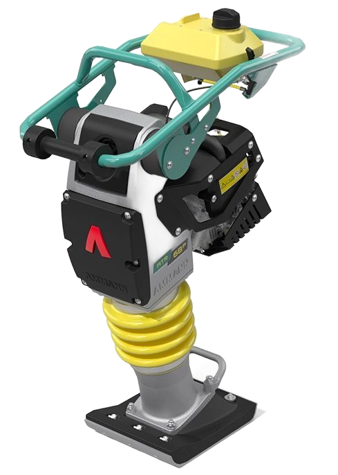 Un compacteur de sol à essence, à guidage manuel, jaune, noir et turquoise, posé sur une plaque sombre.