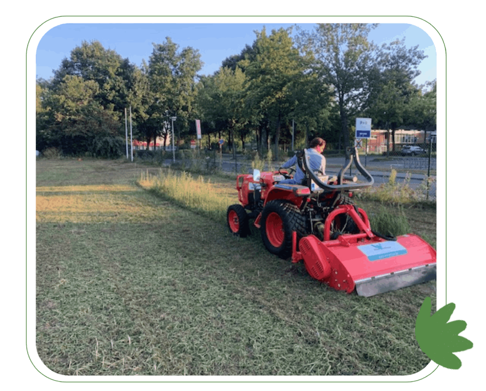 man on a small lawnmower