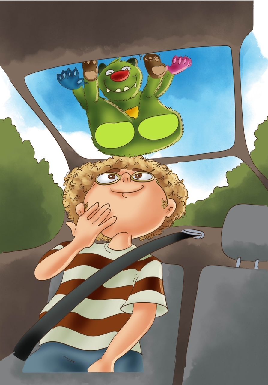 Ein Junge in einem Auto mit einem Monster auf dem Kopf