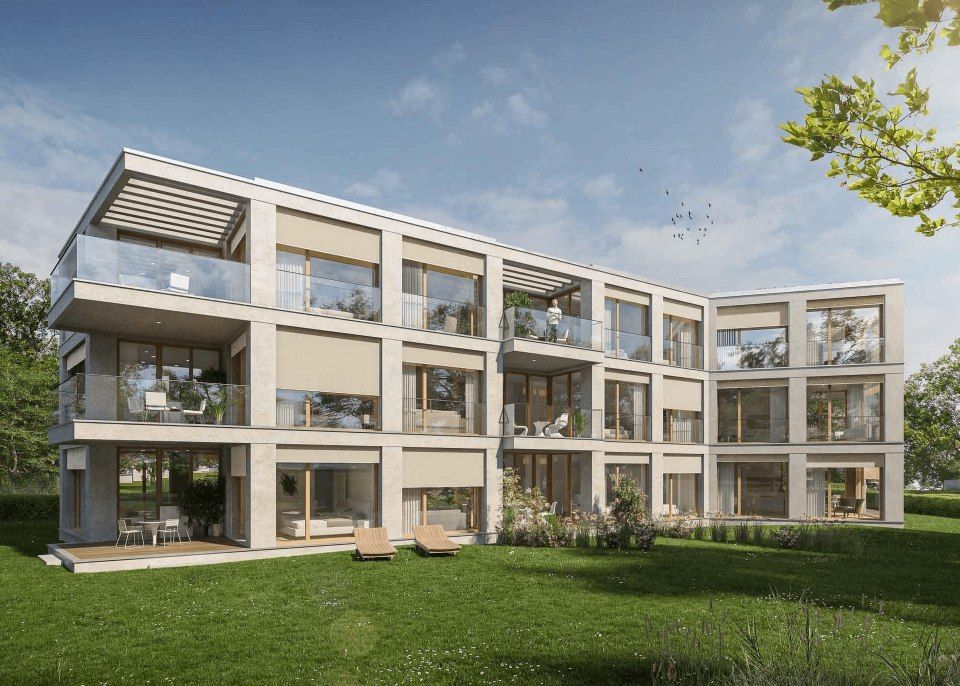 Une impression d'artiste d'un grand immeuble d'appartements avec beaucoup de fenêtres et de balcons.