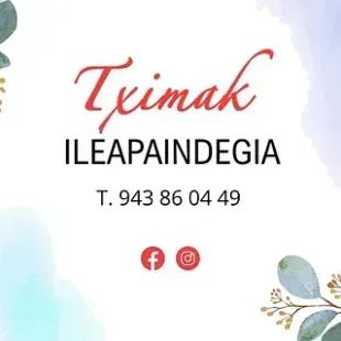 Logotipo de la peluquería Tximak. Texto en cursiva roja: 