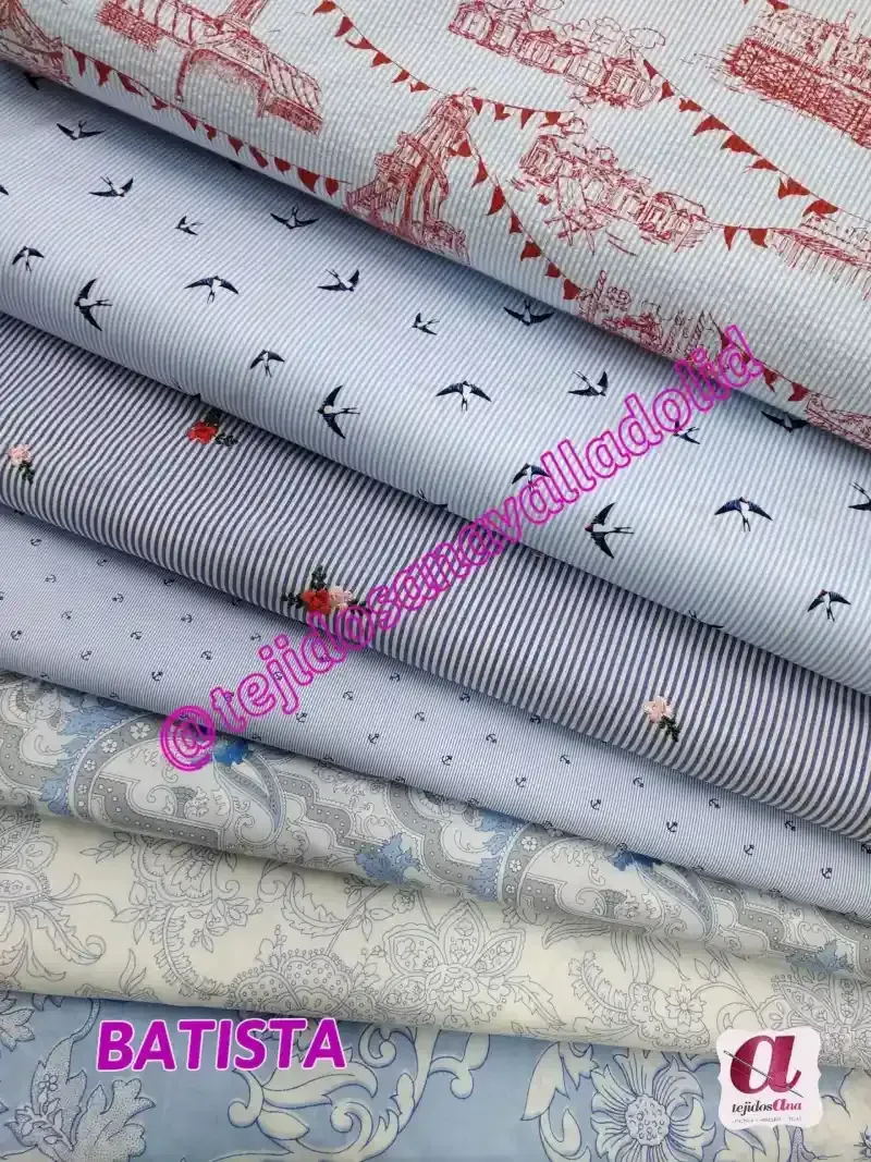 Una pila de telas con batista escrito en la parte inferior