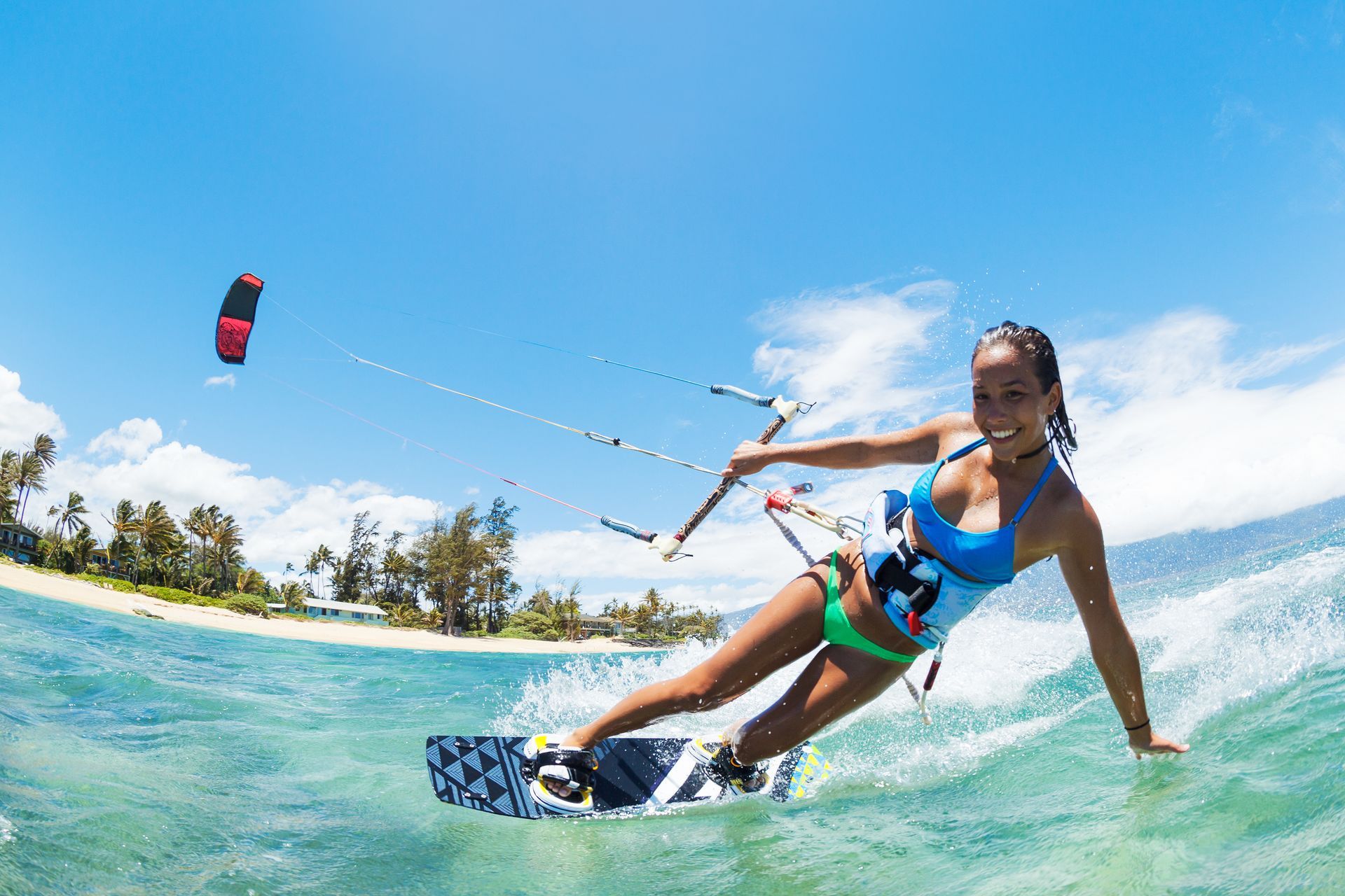 A woman is riding a wave on a surfboard in the ocean.