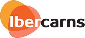 Logotipo de Ibercarns con círculos superpuestos de color naranja y rojo y texto blanco y negro.