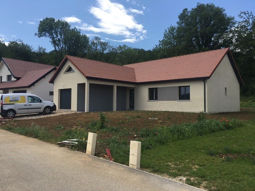 Maison avec effet d'enduit gris