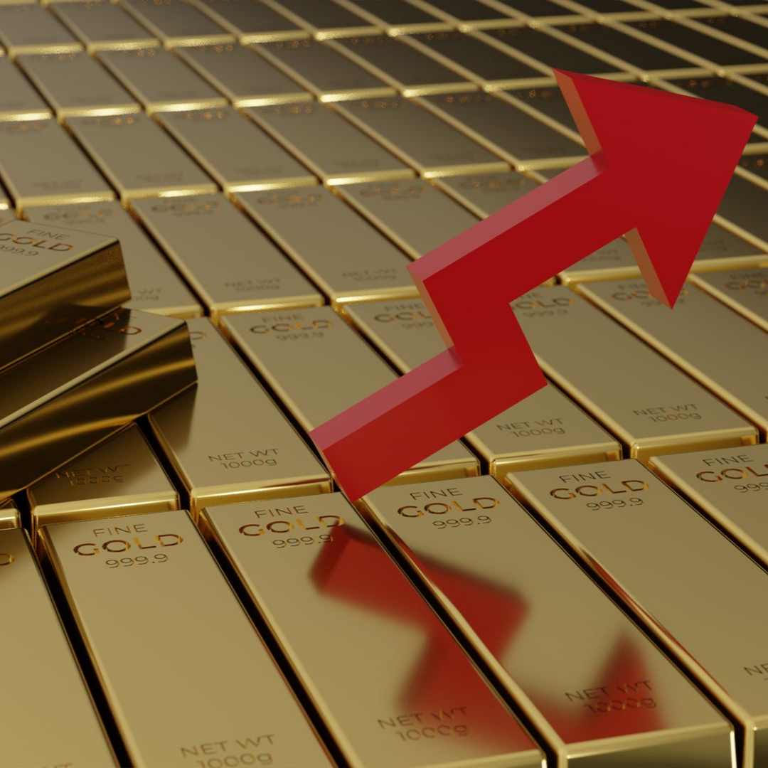 Des lingots d'or et une flèche rouge qui monte