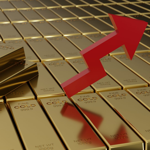 Des lingots d'or et une flèche rouge qui monte
