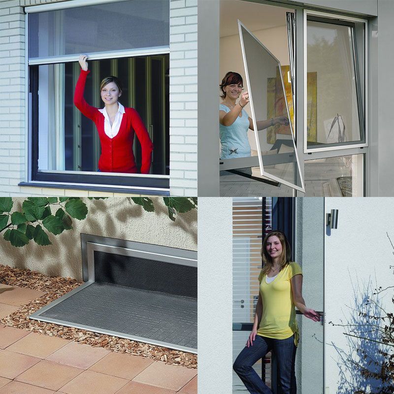Eine Frau in einer roten Jacke schaut aus einem Fenster
