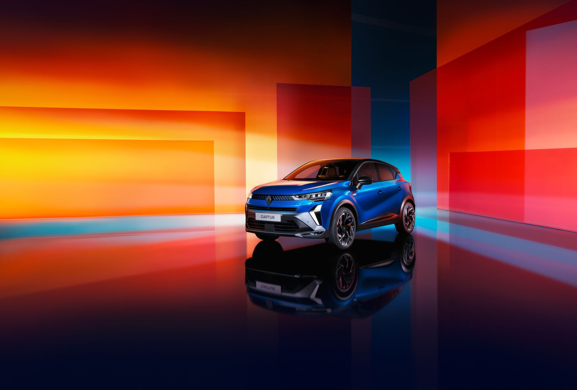 Une voiture bleue sur un fond multicolore.