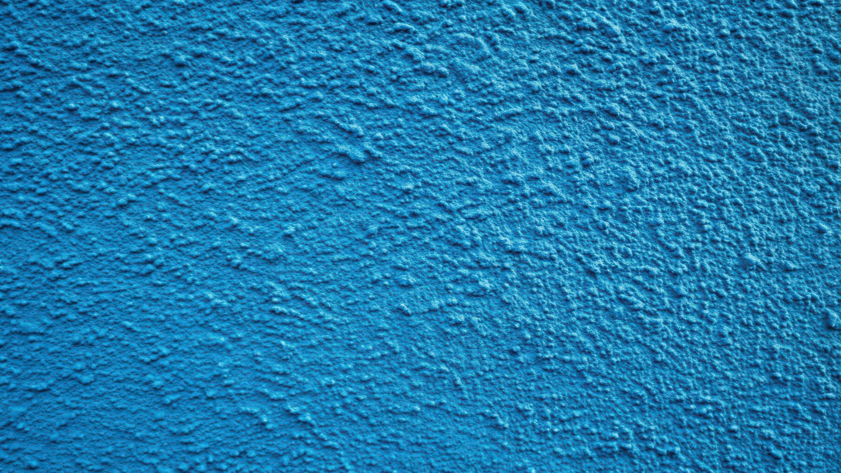 Mur texturé bleu représentant un crépi.