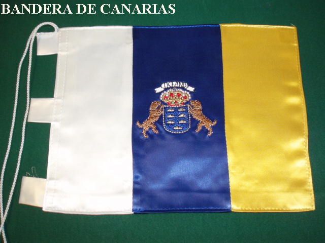 Una bandera azul, blanca y amarilla con las palabras Bandera de Canarias encima.